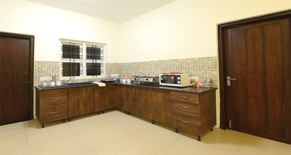 Fully equipped kitchen at Oleander Suites Coorg